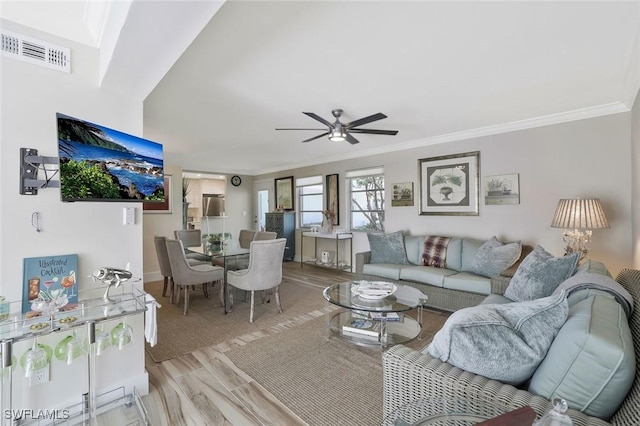 683 12th Ave S Unit 683, Naples, FL 34102 - living area with crown molding, ceiling fan, and light wood-type flooring