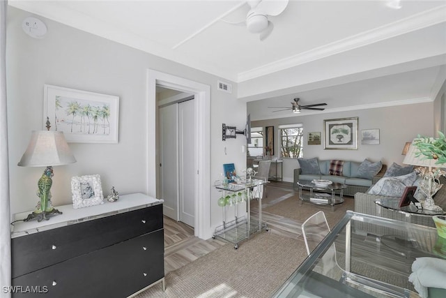 683 12th Ave S Unit 683, Naples, FL 34102 - living area with a ceiling fan, crown molding, baseboards, and light wood-style floors