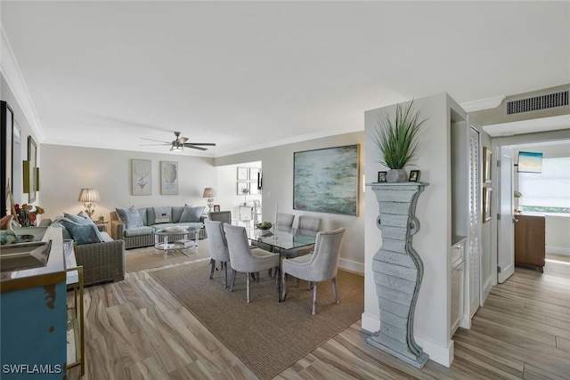 683 12th Ave S Unit 683, Naples, FL 34102 - dining room featuring ornamental molding, ceiling fan, wood finished floors, and baseboards