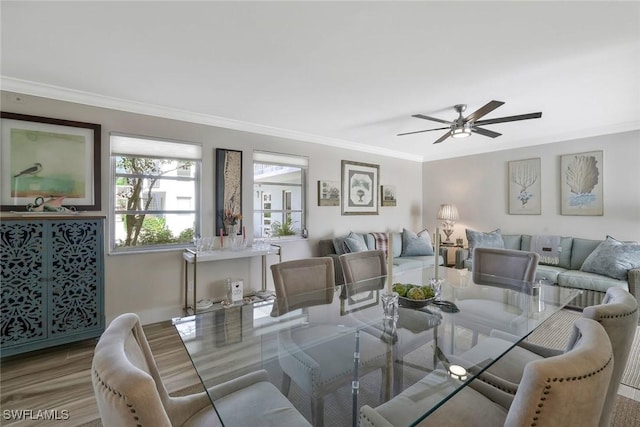 683 12th Ave S Unit 683, Naples, FL 34102 - dining area with crown molding, a ceiling fan, and wood finished floors