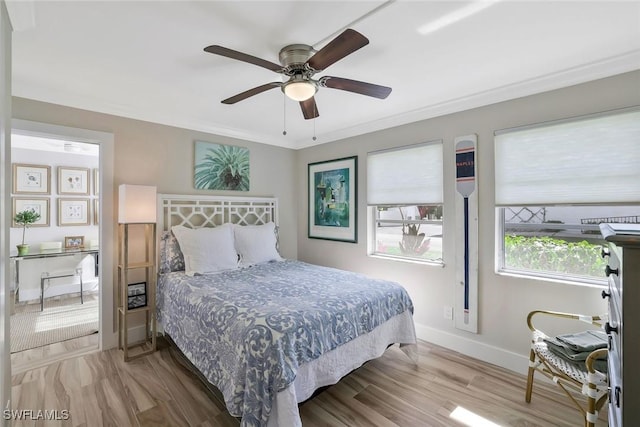 683 12th Ave S Unit 683, Naples, FL 34102 - bedroom featuring baseboards, wood finished floors, and a ceiling fan