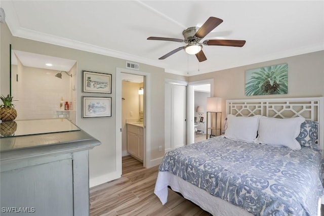 683 12th Ave S Unit 683, Naples, FL 34102 - bedroom with light wood-style flooring, connected bathroom, crown molding, baseboards, and a ceiling fan
