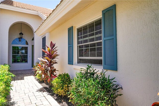 2116 Paget Cir Unit 1, Naples, FL 34112 - entrance to property with stucco siding