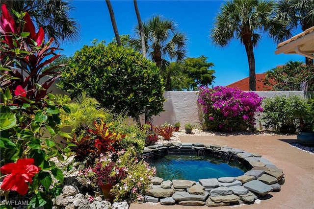 2116 Paget Cir Unit 1, Naples, FL 34112 - view of swimming pool with an in-ground hot tub and a fenced backyard