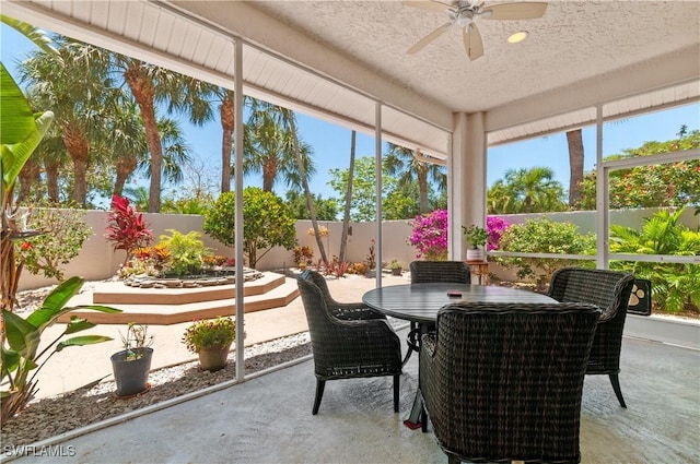 2116 Paget Cir Unit 1, Naples, FL 34112 - sunroom / solarium featuring a ceiling fan, a textured ceiling, and outdoor dining area