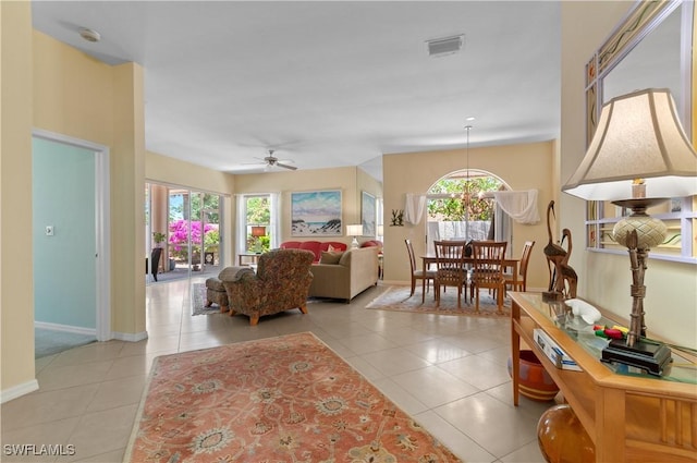 2116 Paget Cir Unit 1, Naples, FL 34112 - living room with healthy amount of natural light, light tile patterned flooring, and baseboards