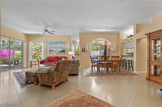2116 Paget Cir Unit 1, Naples, FL 34112 - living room with a ceiling fan, tile patterned floors, and baseboards