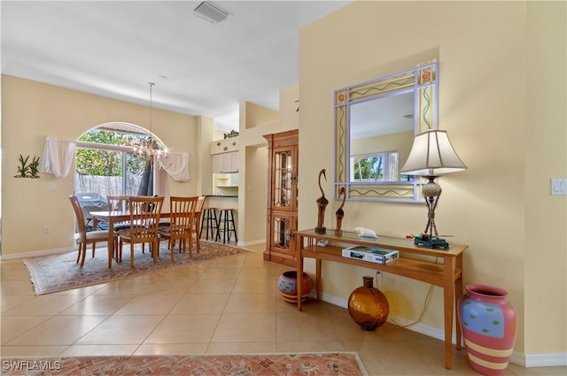 2116 Paget Cir Unit 1, Naples, FL 34112 - tiled dining space featuring healthy amount of natural light and baseboards