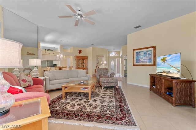 2116 Paget Cir Unit 1, Naples, FL 34112 - living area with ceiling fan, light tile patterned floors, baseboards, and a chandelier