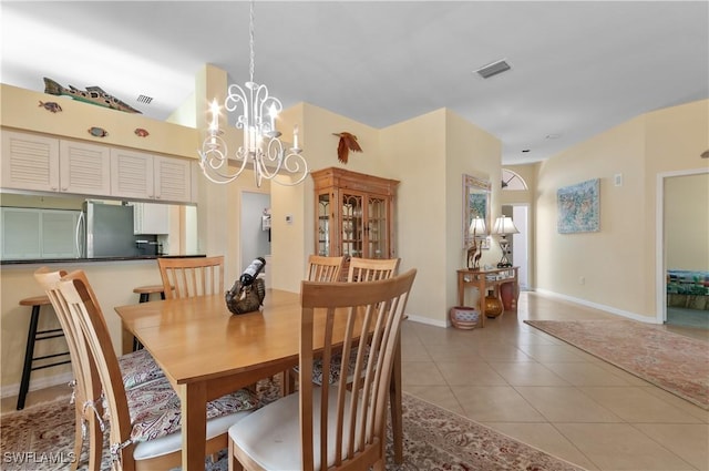 2116 Paget Cir Unit 1, Naples, FL 34112 - dining space with baseboards, light tile patterned floors, and a chandelier