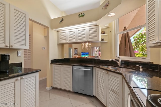 2116 Paget Cir Unit 1, Naples, FL 34112 - kitchen featuring dishwasher, a sink, light tile patterned flooring, and dark stone countertops