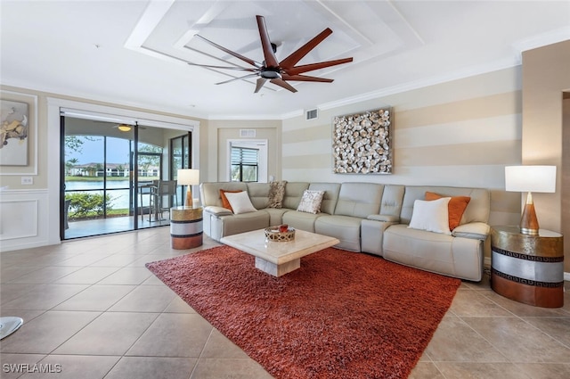 9469 Casoria Ct Unit 101, Naples, FL 34113 - living area featuring ceiling fan, ornamental molding, and tile patterned flooring