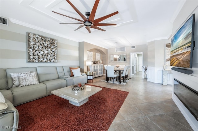 9469 Casoria Ct Unit 101, Naples, FL 34113 - living area with ceiling fan, crown molding, wainscoting, arched walkways, and tile patterned floors