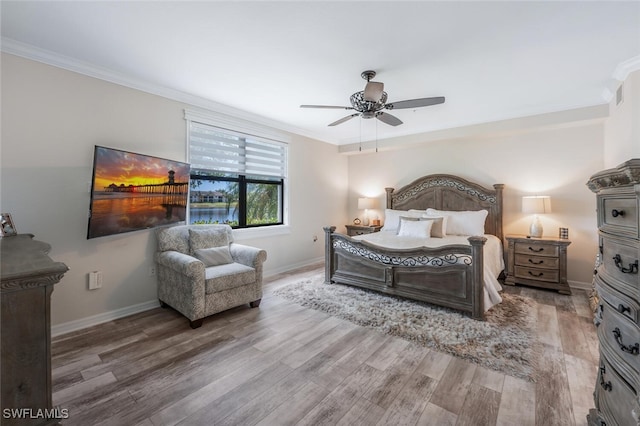 9469 Casoria Ct Unit 101, Naples, FL 34113 - bedroom featuring ornamental molding, wood finished floors, baseboards, and ceiling fan