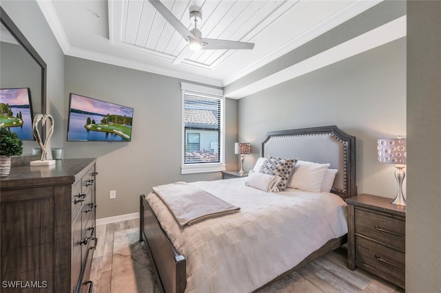 9469 Casoria Ct Unit 101, Naples, FL 34113 - bedroom featuring crown molding, light wood-style floors, baseboards, and a ceiling fan