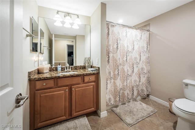 9469 Casoria Ct Unit 101, Naples, FL 34113 - bathroom featuring toilet, vanity, tile patterned flooring, and a shower with shower curtain