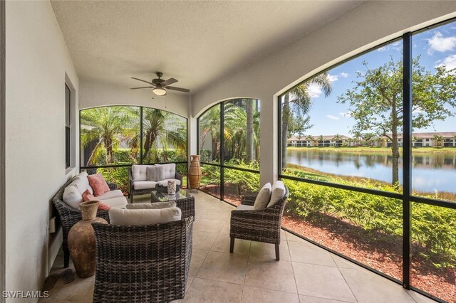 9469 Casoria Ct Unit 101, Naples, FL 34113 - sunroom / solarium featuring a water view, ceiling fan, and outdoor lounge area