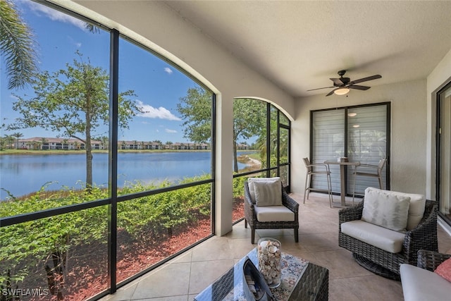 9469 Casoria Ct Unit 101, Naples, FL 34113 - sunroom featuring a water view and a ceiling fan