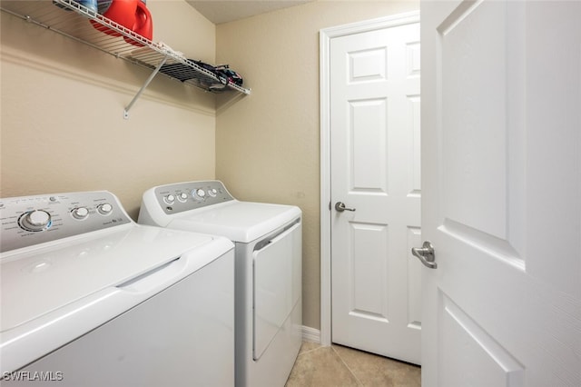 9469 Casoria Ct Unit 101, Naples, FL 34113 - washroom featuring independent washer and dryer and light tile patterned flooring