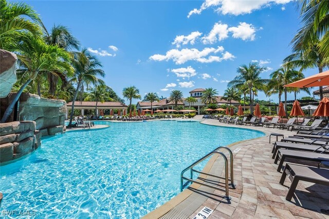 9469 Casoria Ct Unit 101, Naples, FL 34113 - community pool with a patio