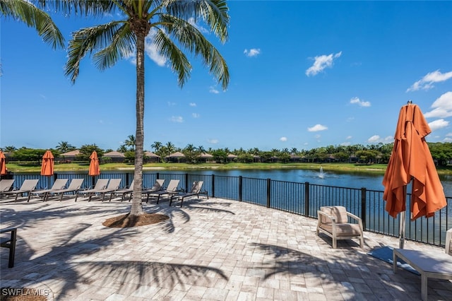 9469 Casoria Ct Unit 101, Naples, FL 34113 - view of patio featuring a water view