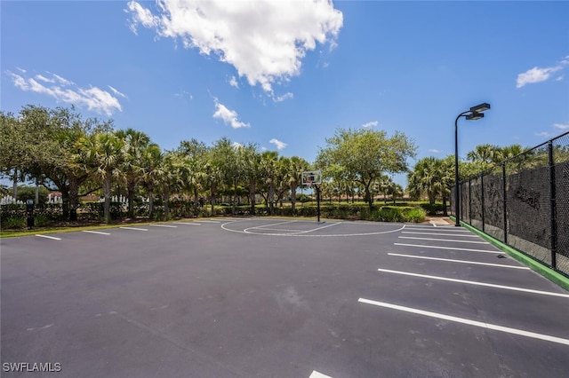 9469 Casoria Ct Unit 101, Naples, FL 34113 - uncovered parking lot featuring community basketball court