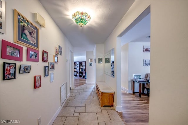 5905 Untermeyer Ct, North Fort Myers, FL 33903 - corridor with baseboards and light stone finish floors