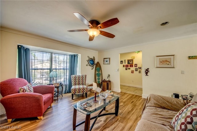 5905 Untermeyer Ct, North Fort Myers, FL 33903 - living room with a ceiling fan, ornamental molding, light wood-style flooring, and baseboards
