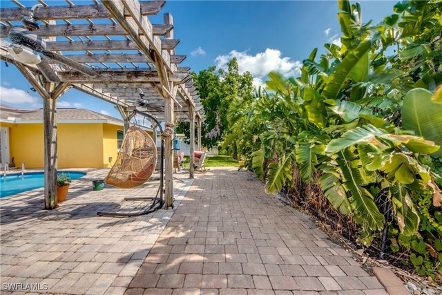 5905 Untermeyer Ct, North Fort Myers, FL 33903 - view of patio / terrace with a pergola and an outdoor pool