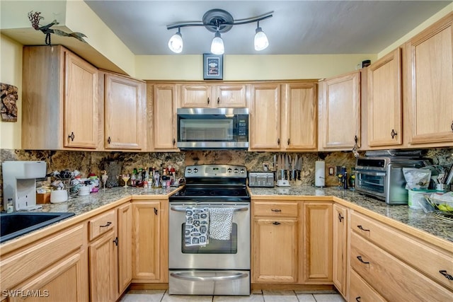5905 Untermeyer Ct, North Fort Myers, FL 33903 - kitchen featuring stainless steel appliances, tile countertops, light brown cabinets, and tasteful backsplash