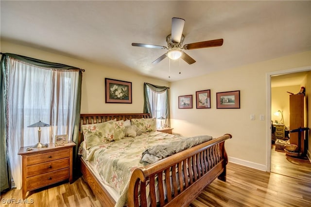 5905 Untermeyer Ct, North Fort Myers, FL 33903 - bedroom featuring wood finished floors, baseboards, and a ceiling fan
