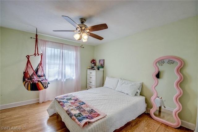 5905 Untermeyer Ct, North Fort Myers, FL 33903 - bedroom with wood finished floors, baseboards, and a ceiling fan