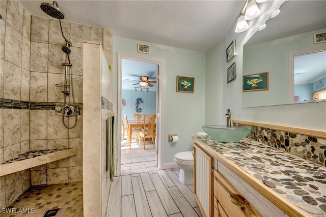 5905 Untermeyer Ct, North Fort Myers, FL 33903 - bathroom with walk in shower, toilet, a ceiling fan, and vanity