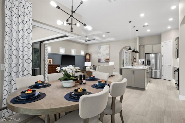9284 Cormorant Dr, Naples, FL 34120 - dining room with recessed lighting, baseboards, arched walkways, and a chandelier