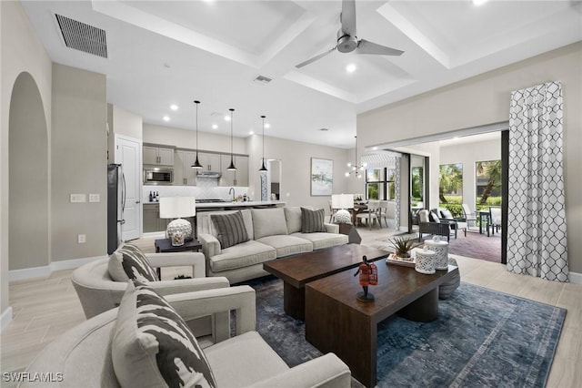 9284 Cormorant Dr, Naples, FL 34120 - living room with coffered ceiling, ceiling fan, recessed lighting, beam ceiling, and baseboards