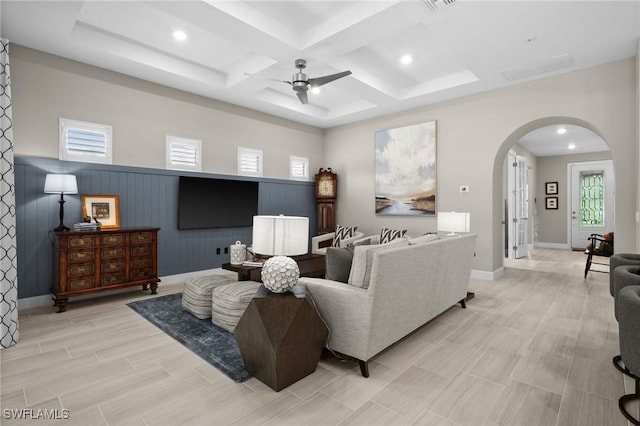 9284 Cormorant Dr, Naples, FL 34120 - living area with arched walkways, a ceiling fan, coffered ceiling, recessed lighting, and beamed ceiling