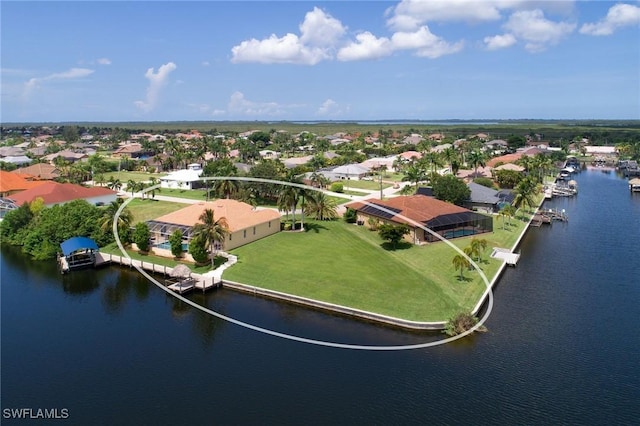 aerial perspective of suburban area with a large body of water