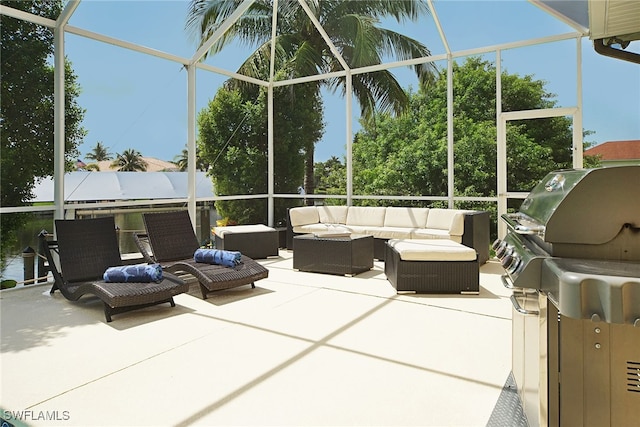 view of patio / terrace featuring outdoor lounge area, a lanai, and a grill