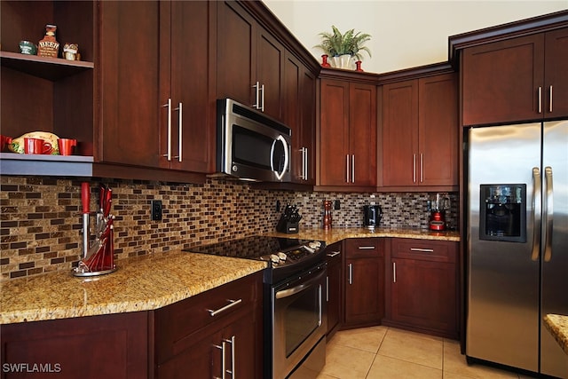 kitchen with stainless steel appliances, light tile patterned floors, light stone countertops, backsplash, and open shelves