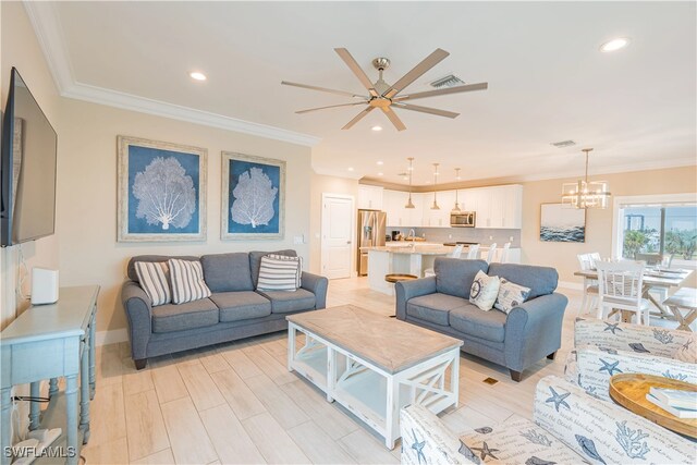 3749 Estero Blvd, Fort Myers Beach, FL 33931 - living room with a ceiling fan, recessed lighting, a chandelier, crown molding, and baseboards