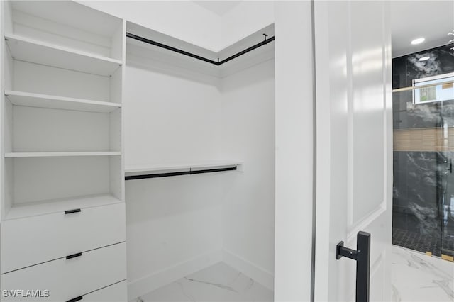 35 Chiquita Blvd N, Cape Coral, FL 33993 - walk in closet featuring marble look tile flooring