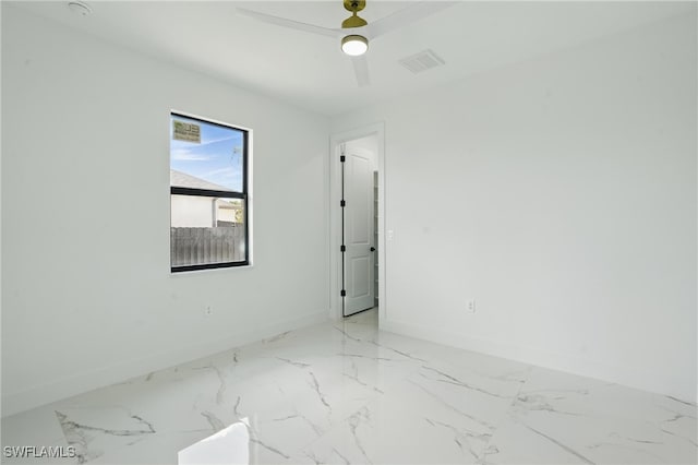 35 Chiquita Blvd N, Cape Coral, FL 33993 - unfurnished room featuring baseboards and light marble finish flooring