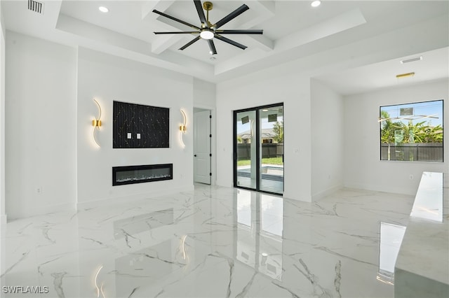 35 Chiquita Blvd N, Cape Coral, FL 33993 - unfurnished living room featuring healthy amount of natural light, recessed lighting, baseboards, a glass covered fireplace, and marble tiled floors