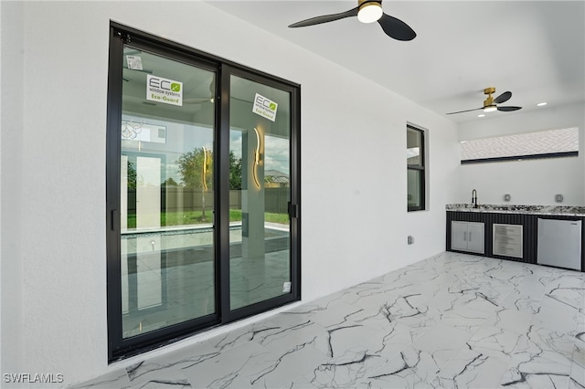 35 Chiquita Blvd N, Cape Coral, FL 33993 - view of patio with ceiling fan and exterior kitchen