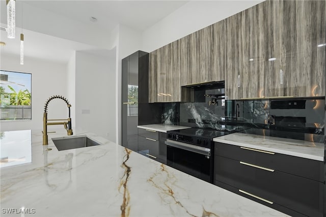 35 Chiquita Blvd N, Cape Coral, FL 33993 - kitchen featuring modern cabinets, black electric range, a sink, light stone countertops, and backsplash