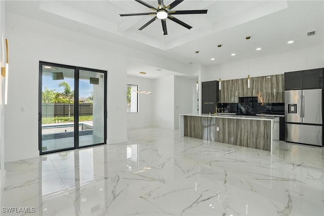 35 Chiquita Blvd N, Cape Coral, FL 33993 - kitchen featuring stainless steel refrigerator with ice dispenser, modern cabinets, recessed lighting, a tray ceiling, and a ceiling fan