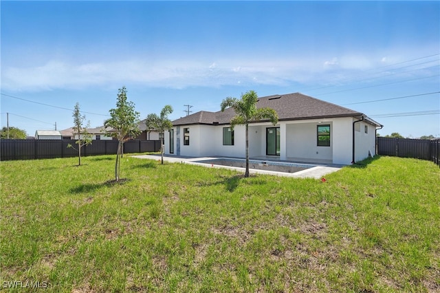 35 Chiquita Blvd N, Cape Coral, FL 33993 - back of property featuring a patio area, stucco siding, and roof with shingles