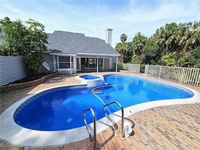 1431 Monarch Cir Unit B8, Naples, FL 34116 - view of pool featuring a patio area, fence, and a pool with connected hot tub
