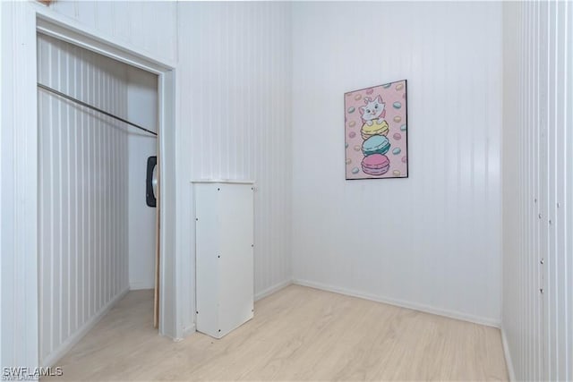 1431 Monarch Cir Unit B8, Naples, FL 34116 - unfurnished bedroom featuring wood finished floors, baseboards, and a closet