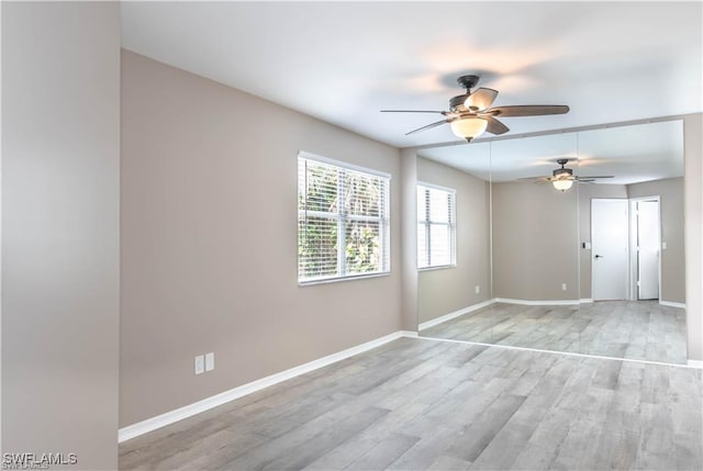 1431 Monarch Cir Unit B8, Naples, FL 34116 - empty room with baseboards, ceiling fan, and light wood-type flooring